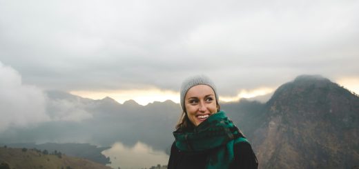 woman wearing green scarf smiling